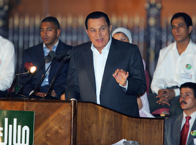 FILE PHOTO: Egyptian President Hosni Mubarak (C) speaks to supporters during a rally in Cairo, Egypt