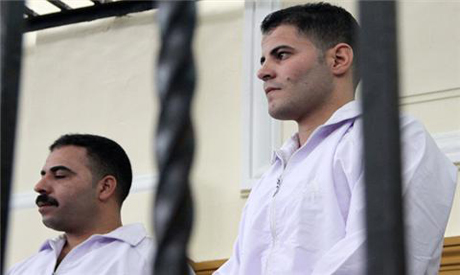 The convicted  two policemen behind bars during the trial 