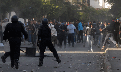 Youth face police forces in the Belcourt district of Algiers