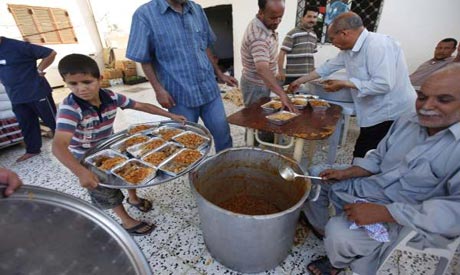 Residents prepare food for rebels fighting in the frontline in Tripoli
