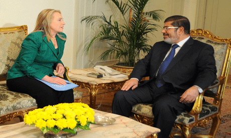 Hillary Clinton and Mohammed Morsi