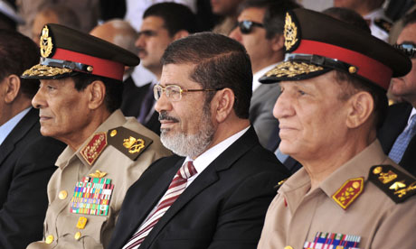 Mohamed Morsi, Hussein Tantawi and Sami Anan in a recent military event (Photo: AP)