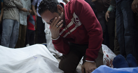 An Egyptian mourns a loved one, who was a supporter of Egypt