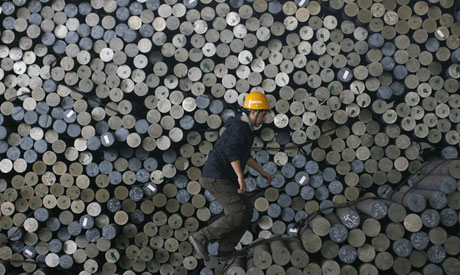 Workers are seen near steel bars at a factory belonging to Ezz Steel (Photo: Reuters)	