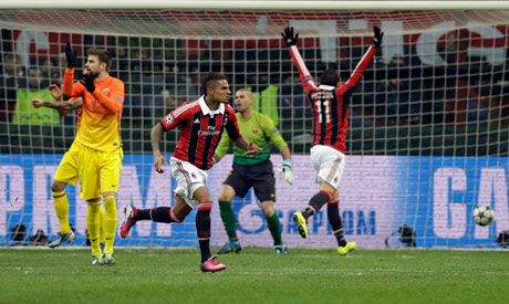 Barcelona midfielder Sergio Busquets heads the ball over AC Milan  midfielder Kevin Prince Boateng, of Ghana, during a Champions League first  leg quarterfinals soccer match, between AC Milan and Barcelona, at the