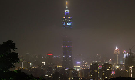 The Taipei 101 Building is seen lit up before the Earth Hour in Taipei, Taiwan AP