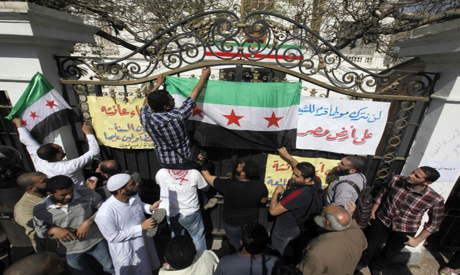 Protesters put Syrian opposition flag 