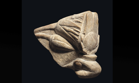 AN EGYPTIAN PAINTED LIMESTONE COBRA HEAD  1550-1069 B.C.