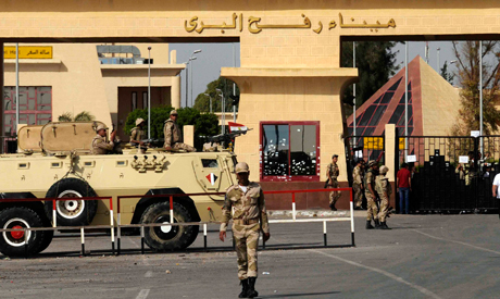 Egyptian Army soldiers guard the gates