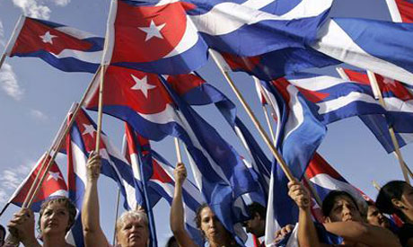 People carry Cuban flags 