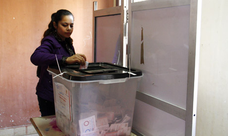 A woman casts her ballot 
