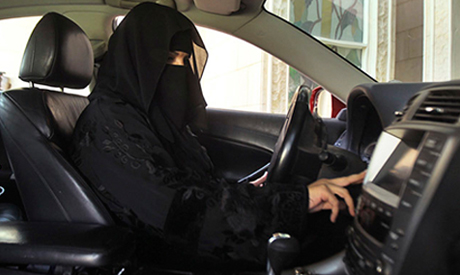 A woman drives a car in Saudi Arabia