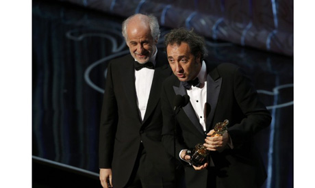 Director Sorrentino actor and Servillo accept the Oscar for best foreign language film for the Itali