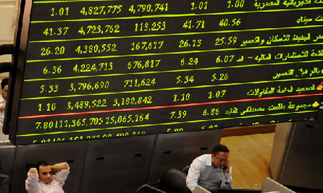 Traders work at the Egyptian Stock Exchange in Cairo
