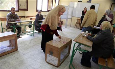 A woman casts her vote