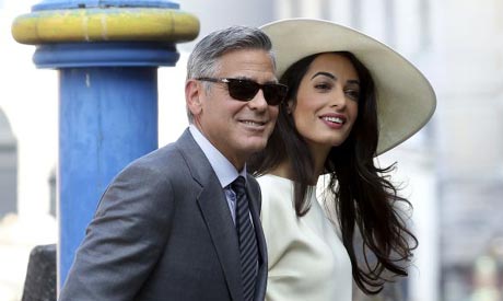 U.S. actor George Clooney and his wife Amal Alamuddin