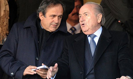 UEFA president Michel Platini talks with FIFA president Sepp Blatter