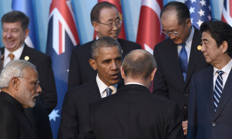 President Barack Obama, center, talks with Russia’s President Vladimir Putin