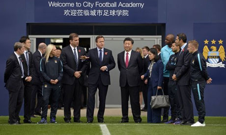 British Prime Minister David Cameron (Centre L) and Chinese President Xi Jinping