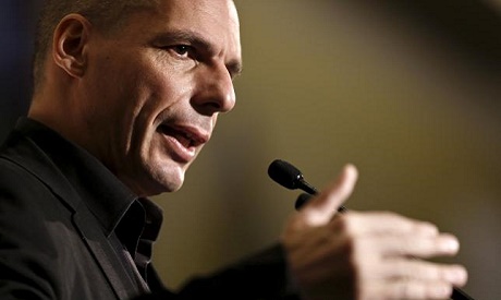 Greek Finance Minister Yanis Varoufakis delivers a speech during The Economist conference on 
