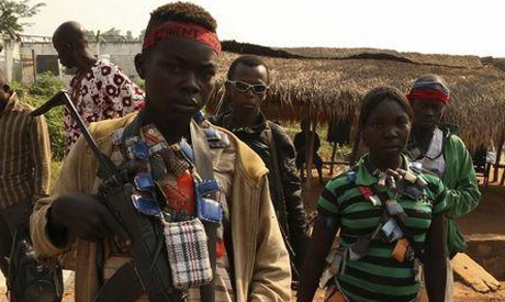  Anti-balaka child soldier wears lucky charms