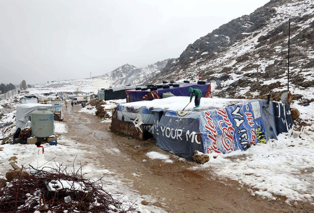 Picture of the day: Syrian refugees struggle with snow storm in Lebanon