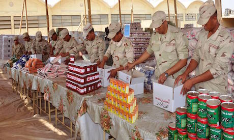 Soldiers preparing food packs