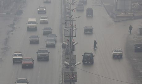 Vehicles travel in cold, wet, rainy and foggy weather in the Maadi suburb of Cairo, Egypt (Reuters)	
