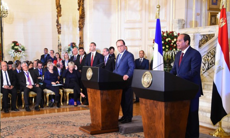 French President Francois Hollande, left, and Egyptian President Abdel-Fattah El-Sisi