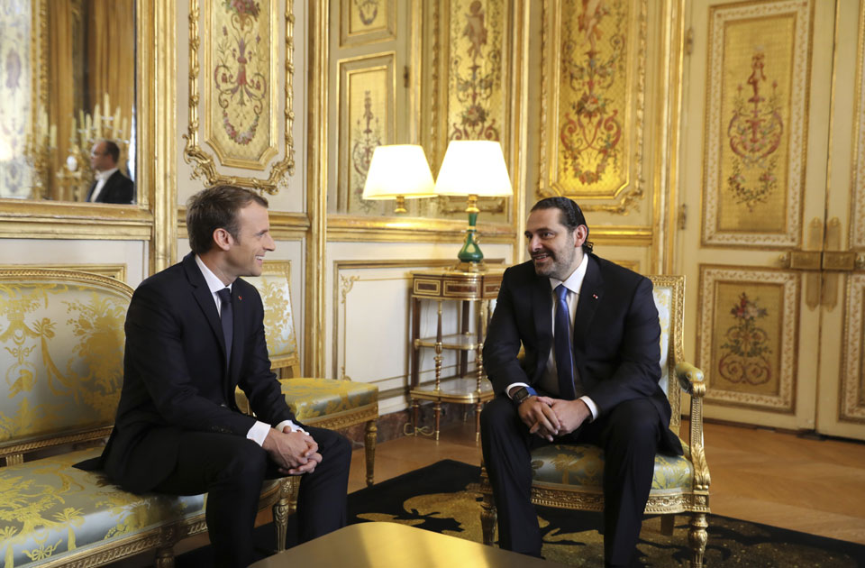 French President Emmanuel Macron and his wife Brigitte Macron stand prior  to welcome Lebanese Prime Minister at the Elysee Presidential Palace on  November 18, 2017 in Paris, France. Saad Hariri, who made