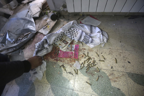 Empty bullet casings lie on the floor in the house of Basil al-Araj in the West Bank city of Ramalla