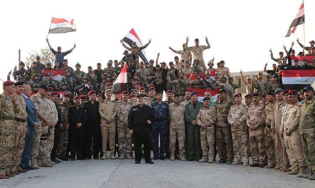 Iraqi Prime Minister Haider al-Abadi (C) announces victory over Islamic State in Mosul, Iraq, July 1