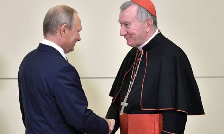  Putin shakes hands with Vatican Secretary of State