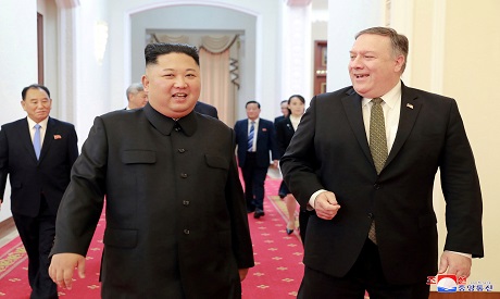 Kim Jong Un and Mike Pompeo