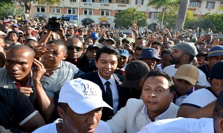 Madagascar’s former President Andry Rajoelina attends a march in protest after the president denounc