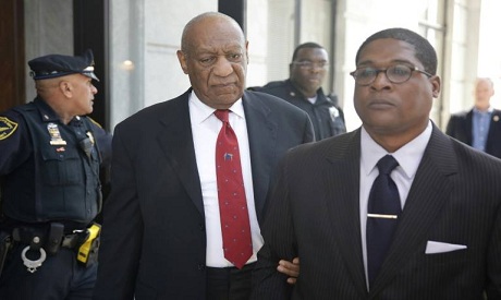 Actor and comedian Bill Cosby (C) leaves the courthouse in Norristown outside Philadelphia, after be
