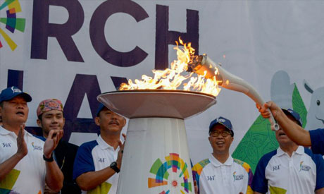 The torch for the 18th Asian Games arrived in Jakarta after an 18,000-km journey across Indonesia (A