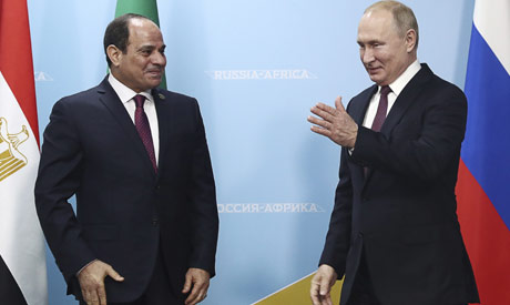 Russian President Vladimir Putin, right, welcomes Egypt
