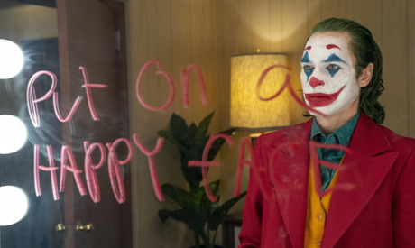 This image released by Warner Bros. Pictures shows Joaquin Phoenix in a scene from the film, "Joker.