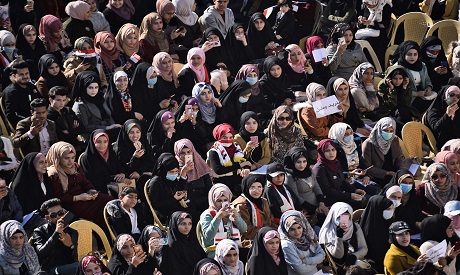 Protesters gather during a sit-in outside the gate of Kufa University