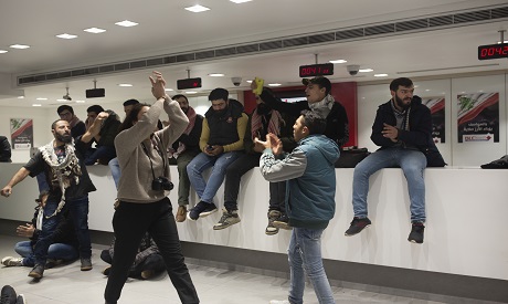 Anti-government protesters occupy the Hamra branch of BLC Bank