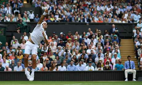Roger Federer serves to Matteo Berrettini in his fourth round match (AFP)