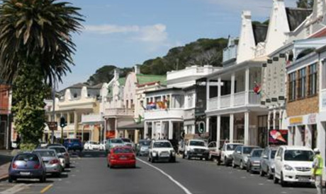 Cars are parked along the historical Saint Georges street in Simon