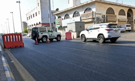 Saudi police close a street leading to a non-Muslim cemetery in the Saudi city of Jeddah