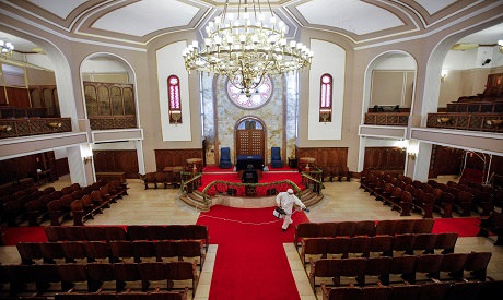Worker disinfects Neve Shalom Synagogue