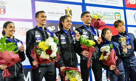 (L-R) Egypt’s penathletes Abdel-Maksoud, El-Gendy, Adel and Hamed holds up their medals on the podiu