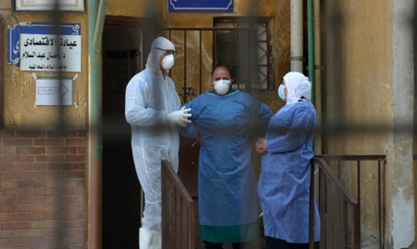Members of the medical staff at the infectious diseases unit of the Imbaba hospital in the capital C