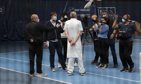 French Tennis Federation Doctor Bernard Montalvan talks to the media during a training session in th