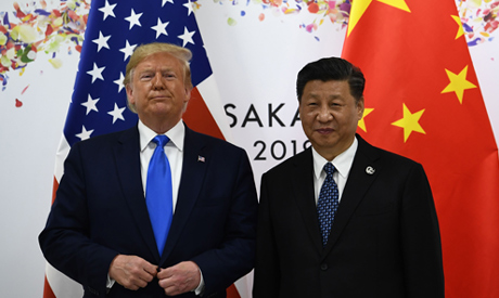 File photo : taken on June 29, 2019, Chinese President Xi Jinping (R) and US President Donald Trump 