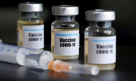 "Vaccine COVID-19" stickers on small bottles